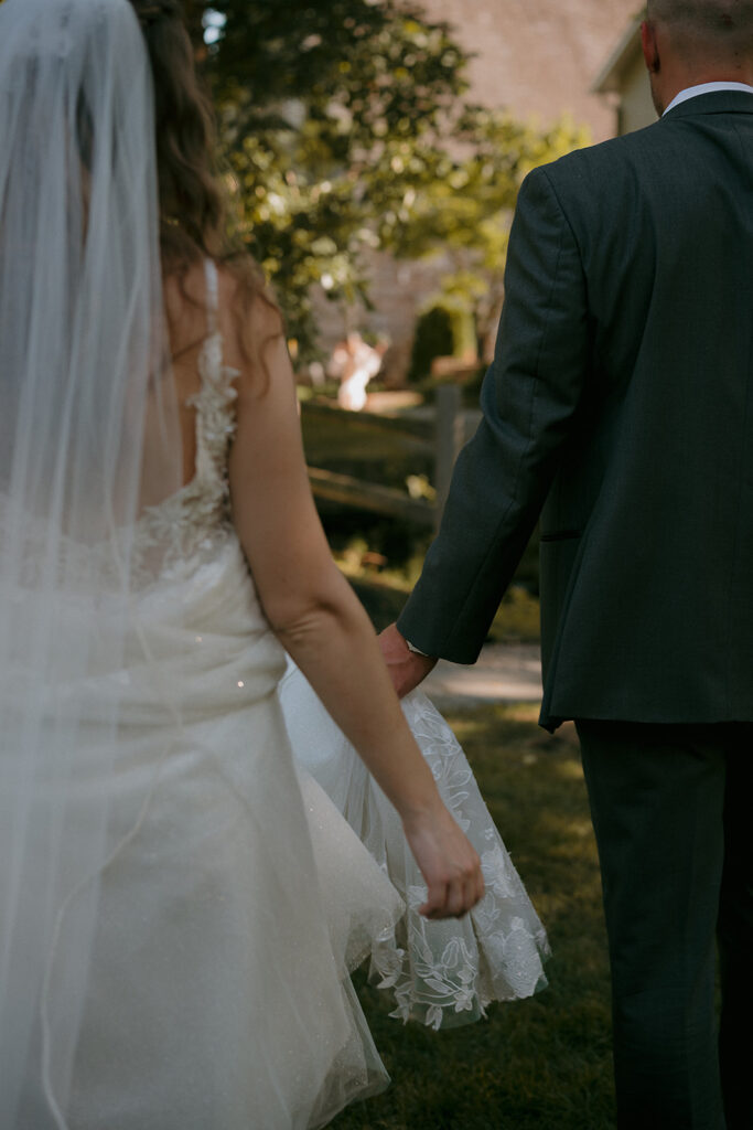 Close up shot of a bride and groom walking together