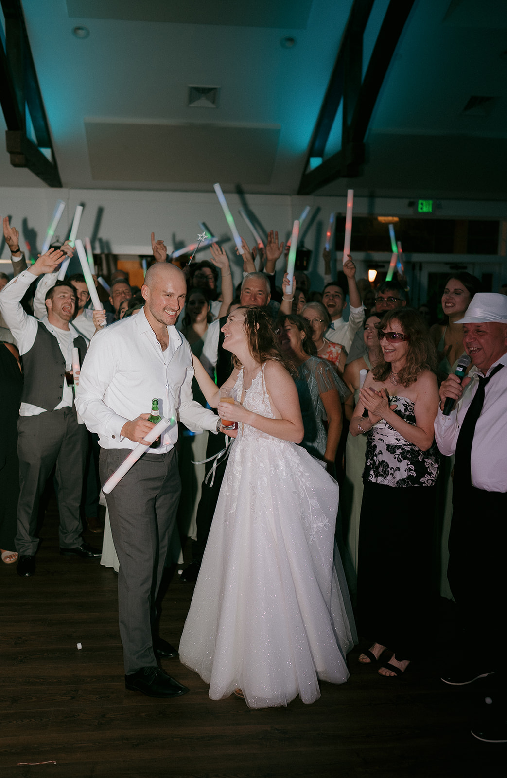 Bride and groom laughing during their reception