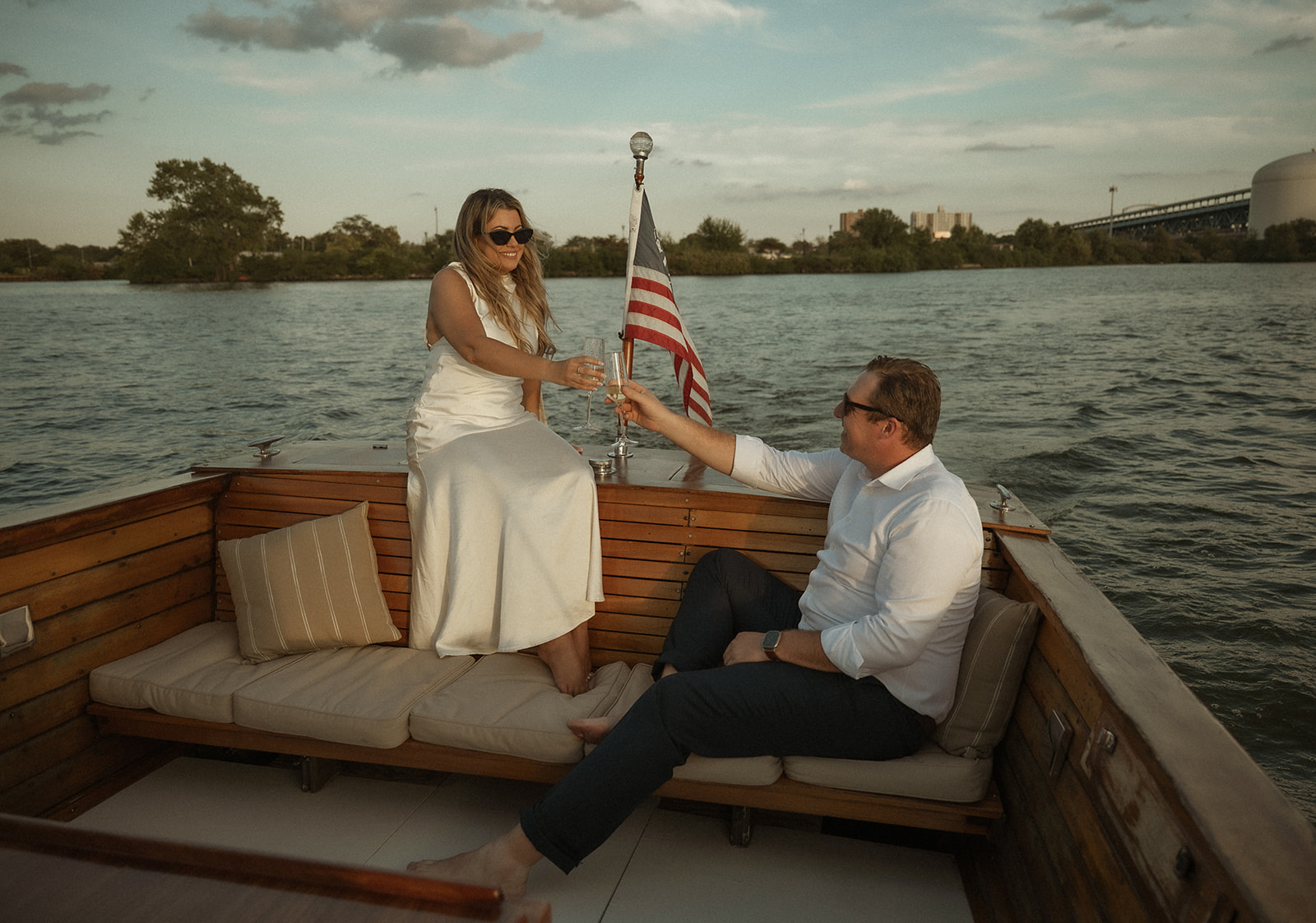 Couple toasting champagne while on the Argonaut with Sea Philly