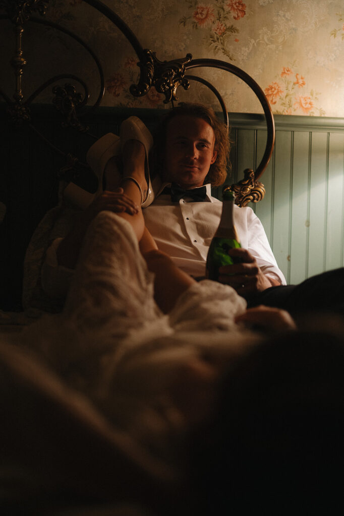 Bride framed by warm lamplight in the cottage kitchen, captured during Jordie and Jesse’s intimate wedding photo session in Frenchtown, New Jersey.
