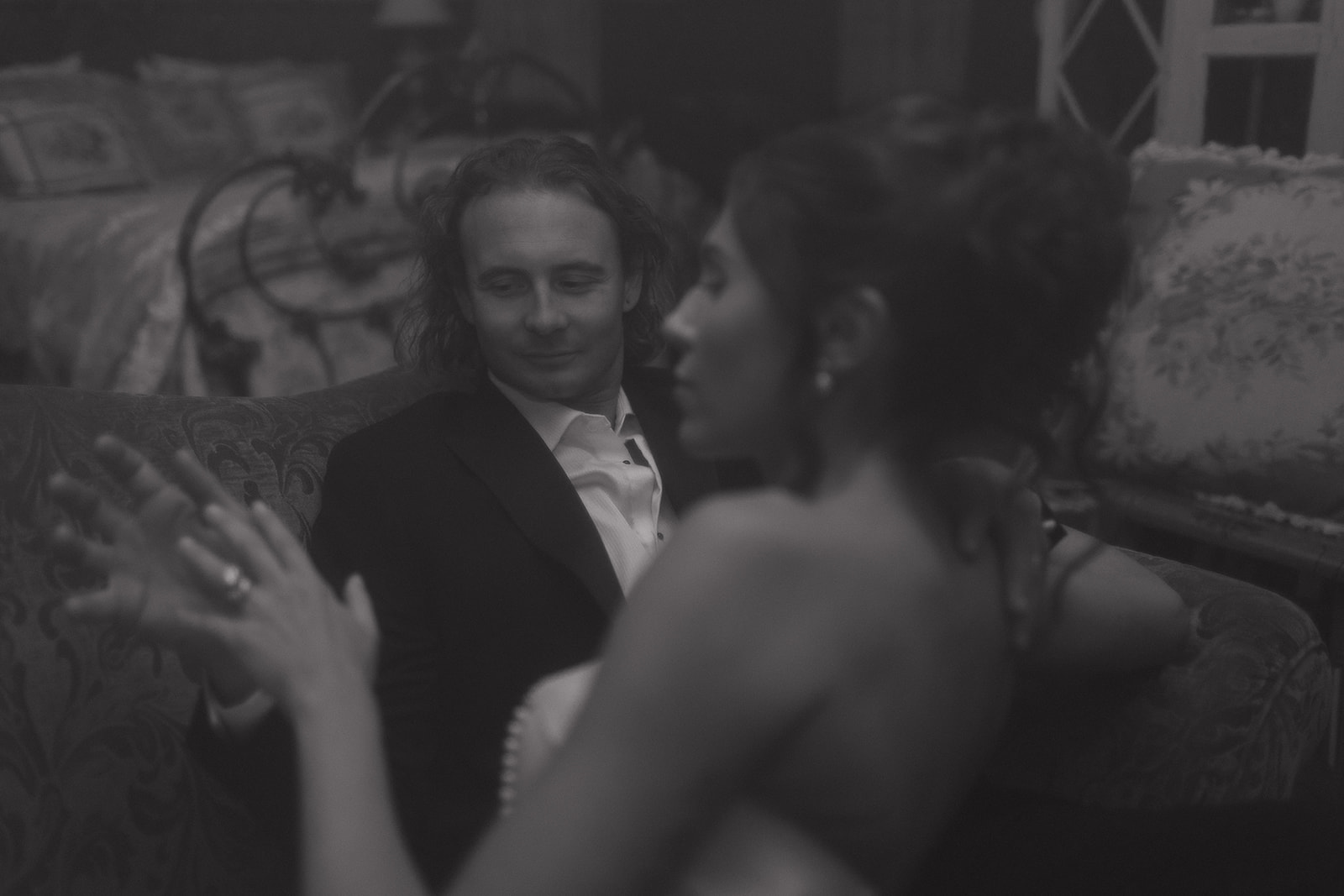 Black-and-white portrait of Jordie and Jesse relaxing together in the cottage, evoking a timeless, film-inspired mood by New Jersey wedding photographer Ell Peters.