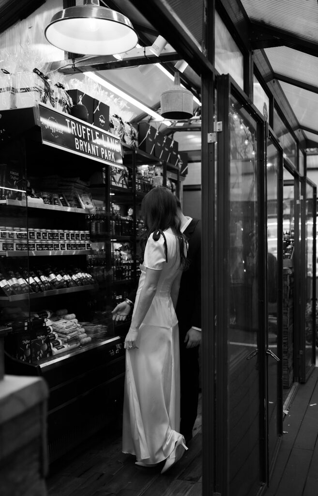 Black and white photo of a couple at The Truffelist in Bryant Park. 