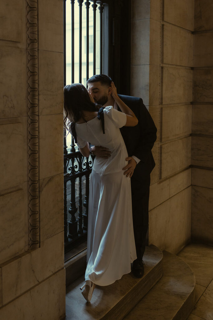 Couple kissing during their romantic engagement session in NY.