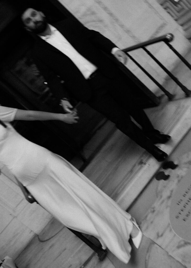 Close up shot of a couple holding hands and walking together. 