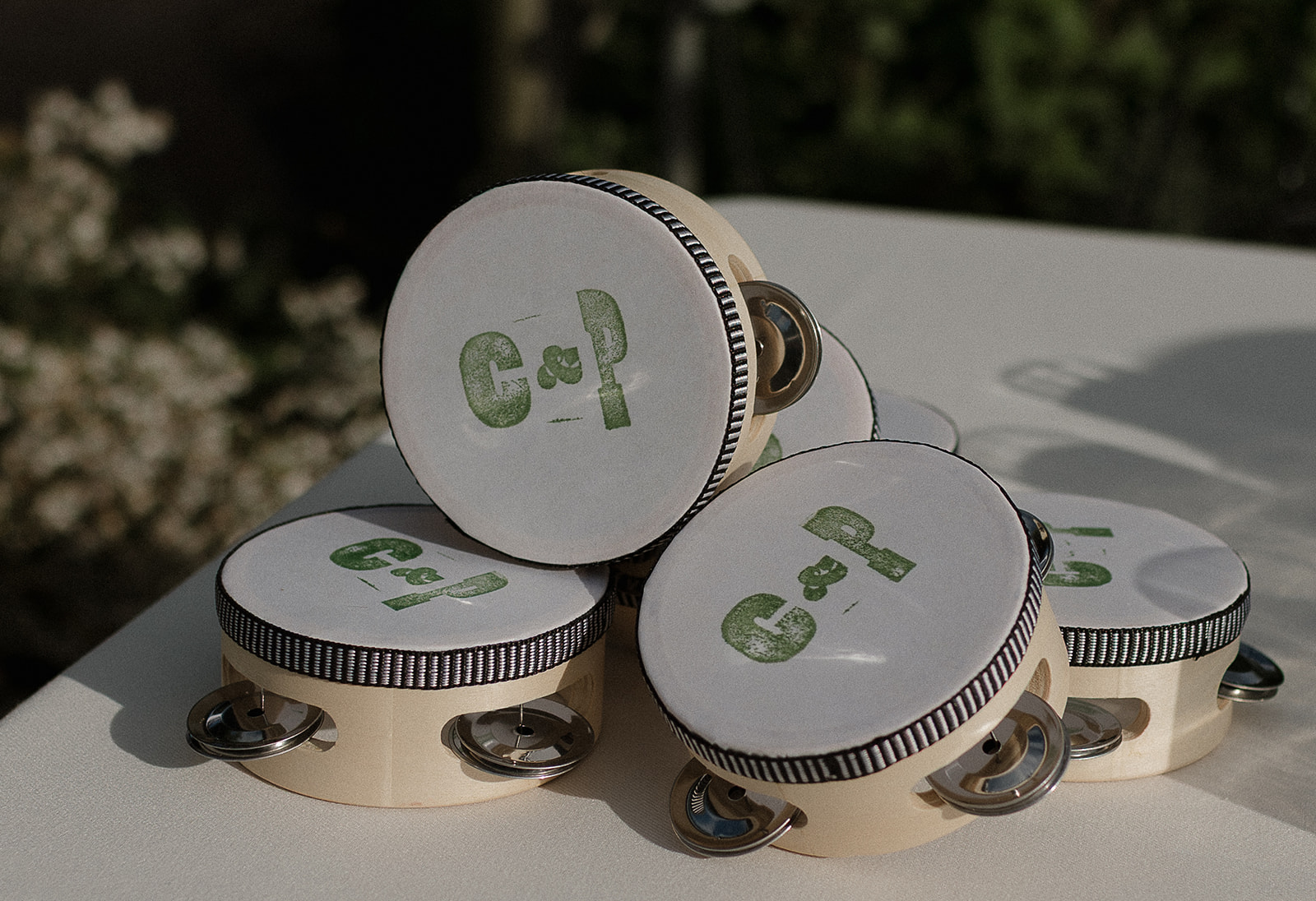 Custom tambourines with couple initials used for ceremony recessional at Stone Acres Farm wedding.