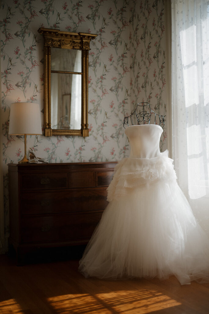 Vera Wang dress in elegant getting ready room at Stone Acres Farm wedding.