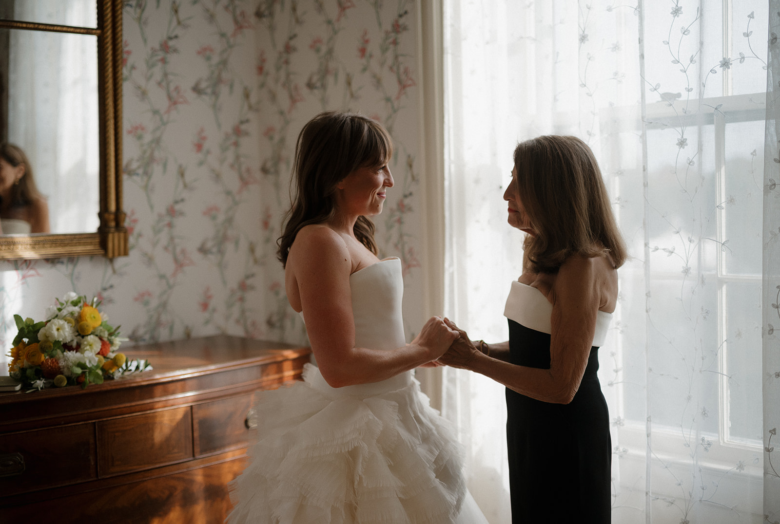 Bride sharing emotional moment with mother in the Manor House at Stone Acres Farm wedding in Connecticut.