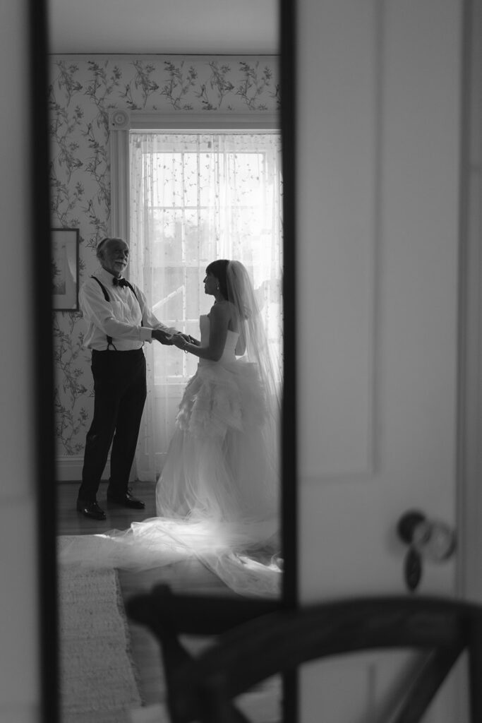 Bride and father holding hands before ceremony during intimate Stone Acres Farm wedding morning.