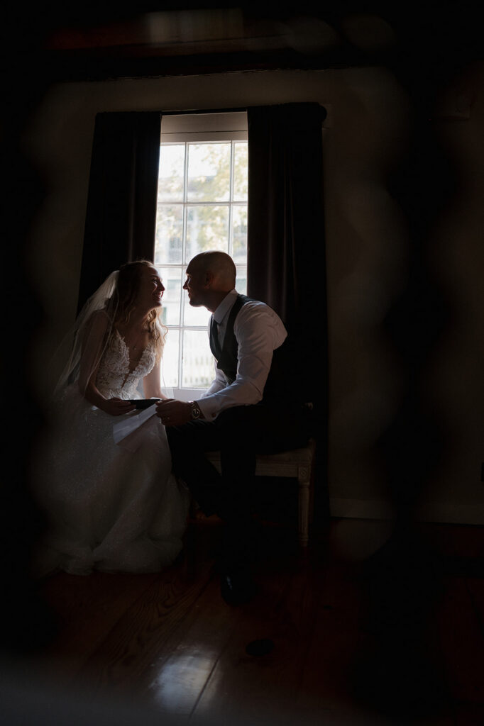 Bride and groom reading their private vows to one another. 