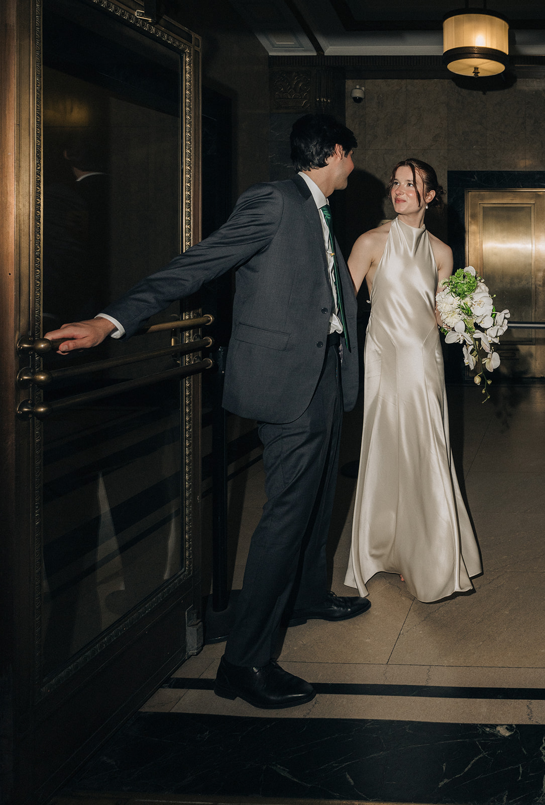 Bride and grooms NYC City Hall elopement photos.