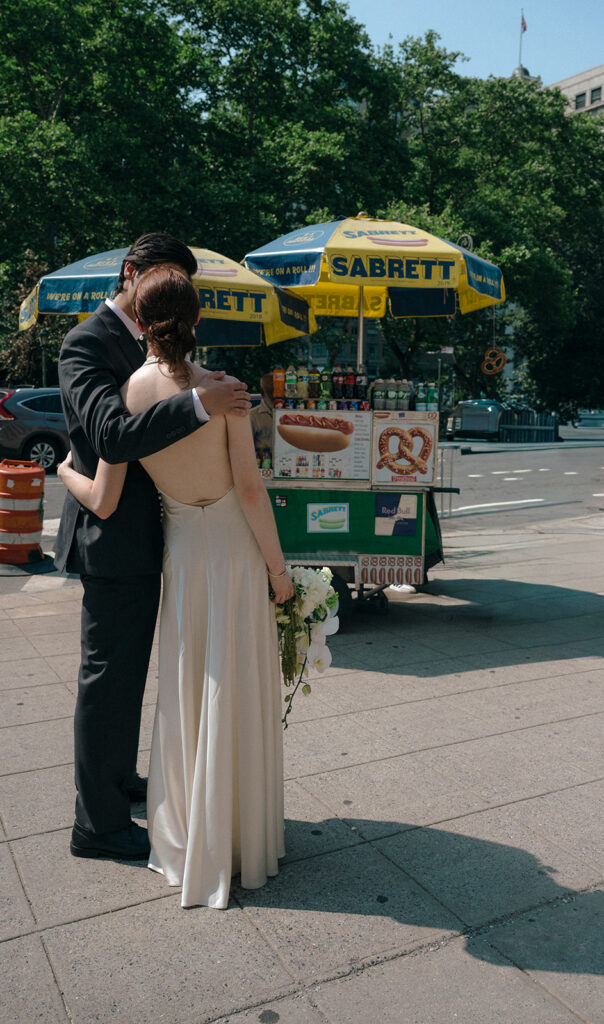 Couple posing in downtown NYC during their elopement.