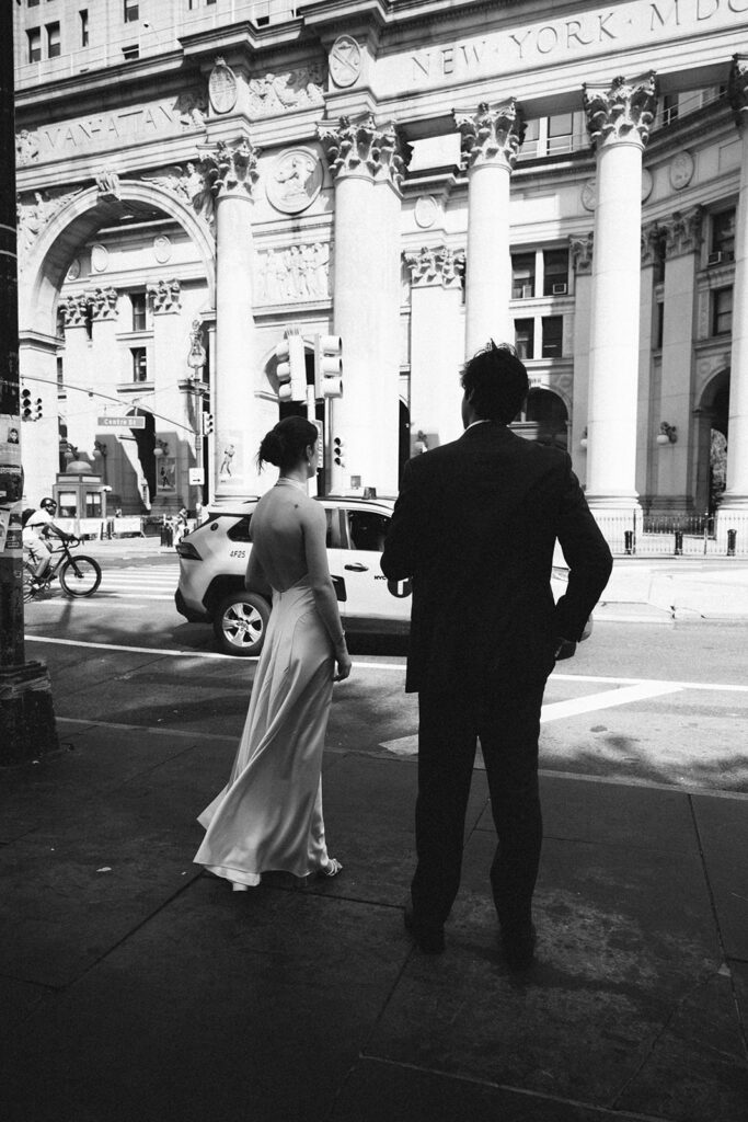 Black and white photo of a bride and groom in downtown NYC.